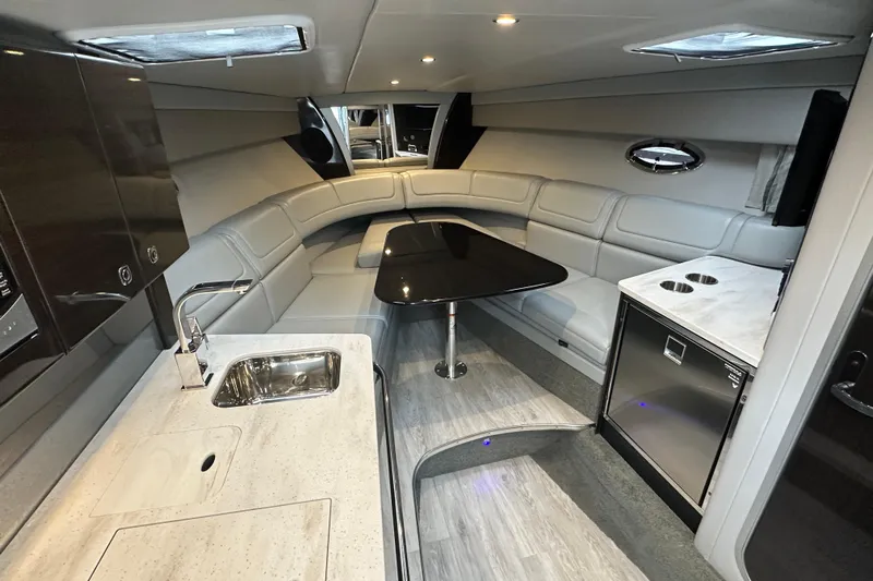  Yacht Photos Pics Luxurious interior of 2021 Formula 350 Sun Sport yacht with modern seating and kitchenette.