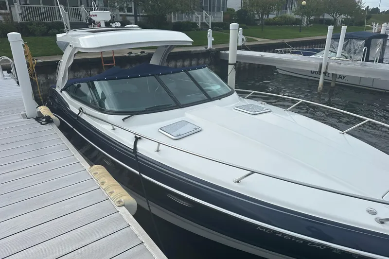  Yacht Photos Pics 2021 Formula 350 Sun Sport boat docked at a marina, featuring sleek design and modern amenities.