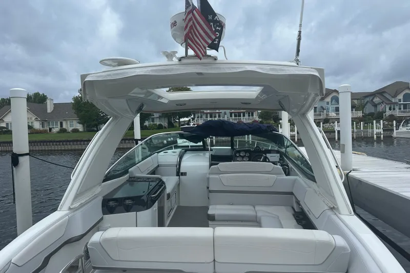  Yacht Photos Pics 2021 Formula 350 Sun Sport boat docked at marina, featuring spacious seating and modern design.