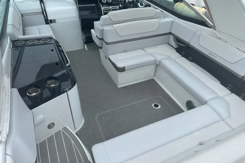  Yacht Photos Pics 2021 Formula 350 Sun Sport boat interior with white seating and cup holders.