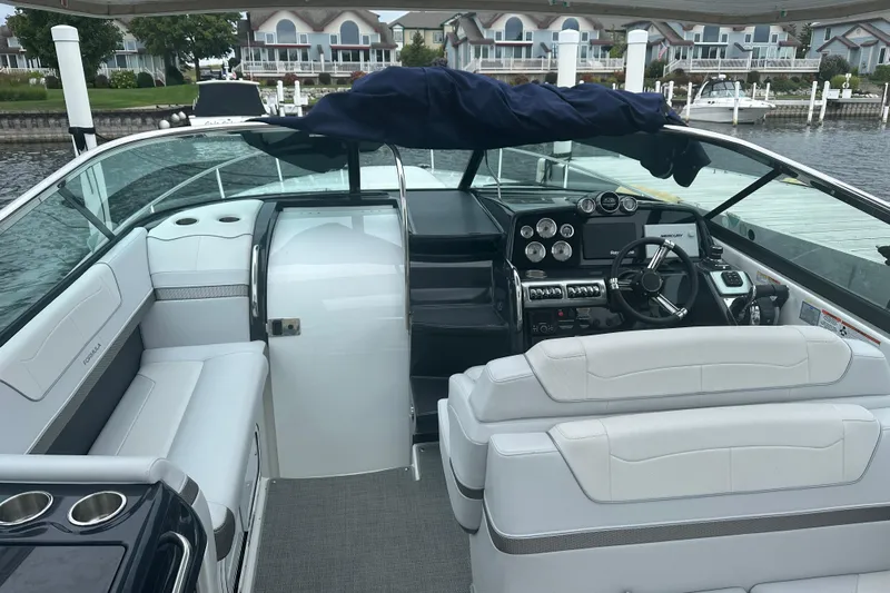  Yacht Photos Pics 2021 Formula 350 Sun Sport boat interior with modern dashboard and seating.