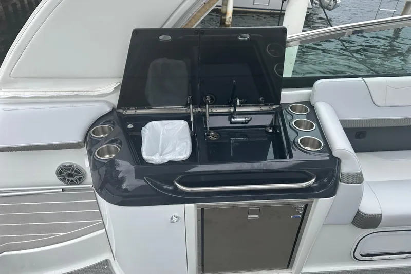  Yacht Photos Pics 2021 Formula 350 Sun Sport boat interior with sink and cup holders.