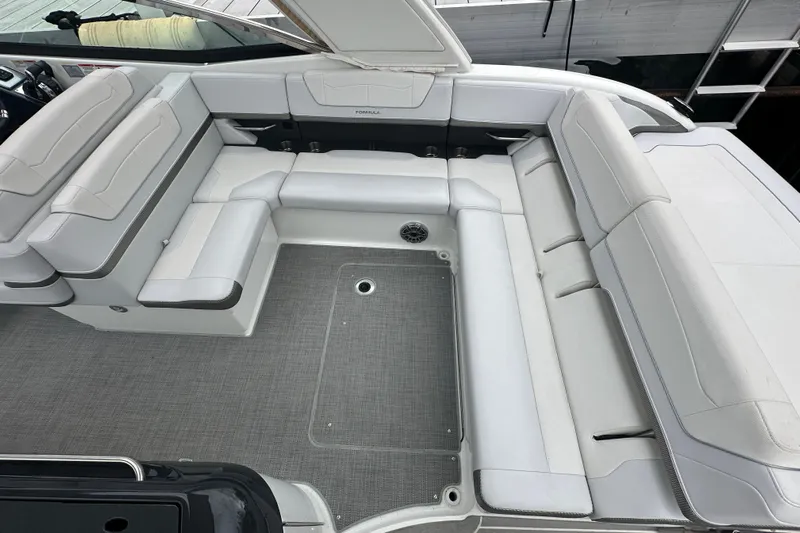  Yacht Photos Pics 2021 Formula 350 Sun Sport boat interior with spacious white seating and gray flooring.