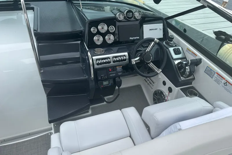  Yacht Photos Pics 2021 Formula 350 Sun Sport boat cockpit with modern steering and control panel.