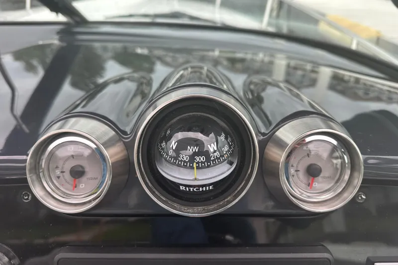  Yacht Photos Pics Dashboard of a 2021 Formula 350 Sun Sport with compass and trim gauges.
