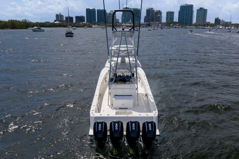 39z Yacht Photos Pics 2017 SeaVee 390 boat with four outboard engines on a bustling waterway.