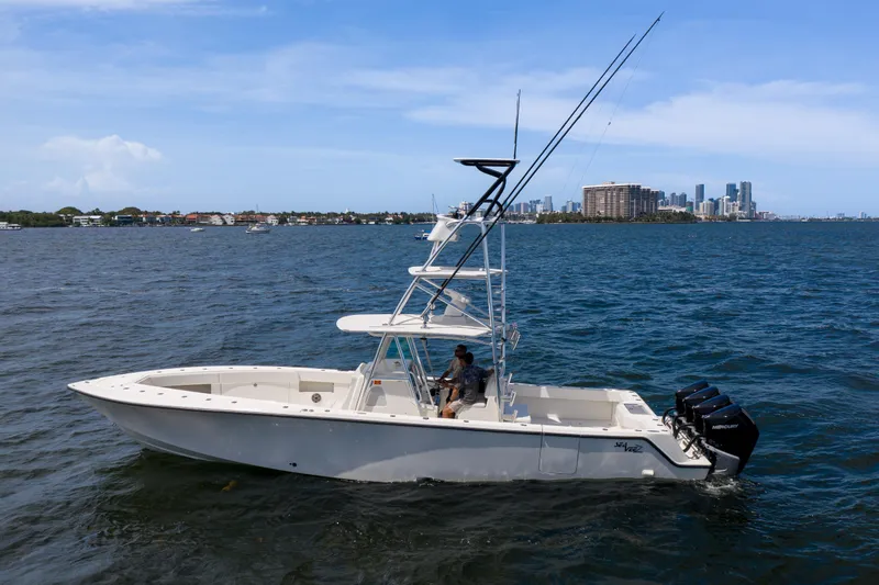 39z Yacht Photos Pics 2017 SeaVee 390 boat on water with city skyline in background.