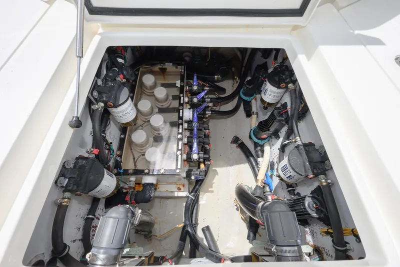 39z Yacht Photos Pics Engine compartment of 2017 SeaVee 390 boat, showcasing pumps and wiring.