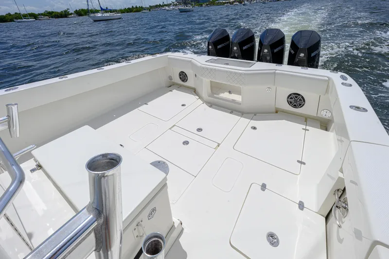 39z Yacht Photos Pics 2017 SeaVee 390 boat deck with multiple storage compartments and four outboard motors.
