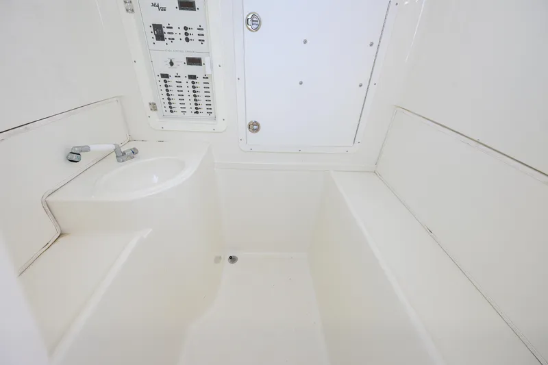 39z Yacht Photos Pics 2017 SeaVee 390 interior with control panel and sink, featuring a clean, white design.