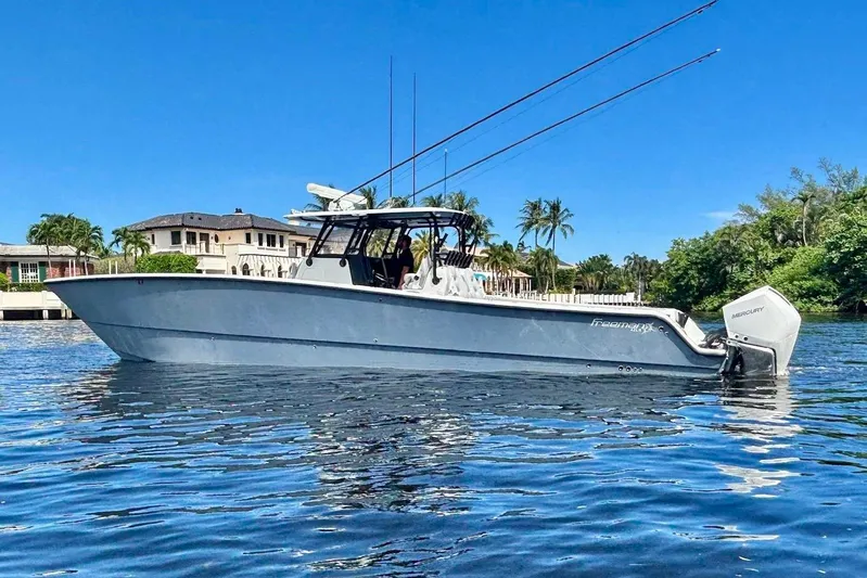  Yacht Photos Pics 2019 Freeman 42 LR boat on calm water, clear blue sky background.