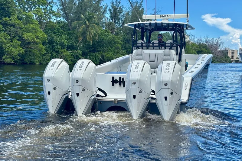  Yacht Photos Pics 2019 Freeman 42 LR boat with four powerful outboard engines on a scenic waterway.