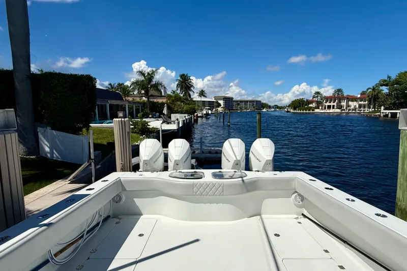  Yacht Photos Pics 2019 Freeman 42 LR boat docked by a scenic waterfront with clear blue skies.