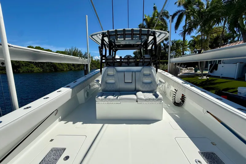  Yacht Photos Pics 2019 Freeman 42 LR boat interior with seating, surrounded by water and palm trees.
