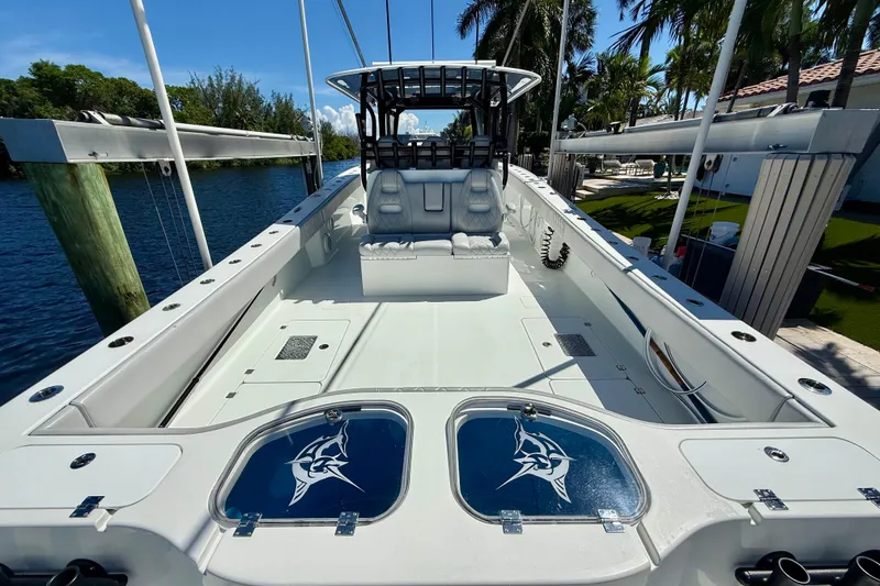  Yacht Photos Pics 2019 Freeman 42 LR boat interior with seating, fishing rod holders, and storage compartments.