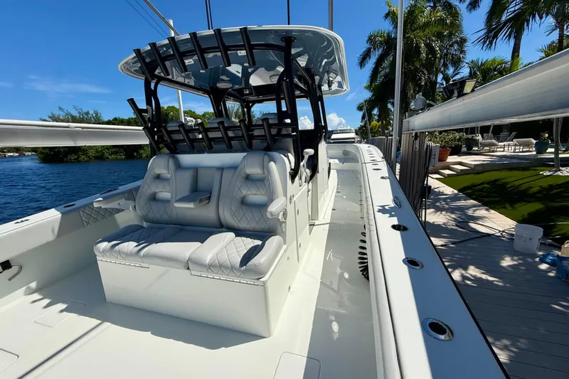  Yacht Photos Pics 2019 Freeman 42 LR boat docked, featuring sleek seating and modern design under a clear blue sky.