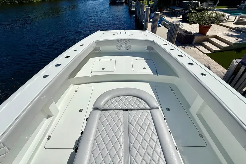  Yacht Photos Pics 2019 Freeman 42 LR boat with sleek seating and storage, docked by a waterfront.