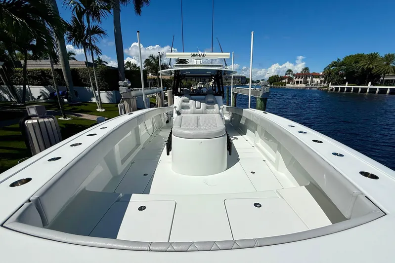  Yacht Photos Pics 2019 Freeman 42 LR boat docked by waterfront, featuring spacious deck and modern design.