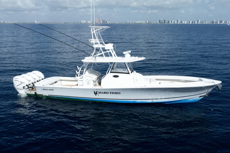 Tt Hard Times Yacht Photos Pics 2020 Regulator motor yacht on open water, featuring triple Yamaha engines.
