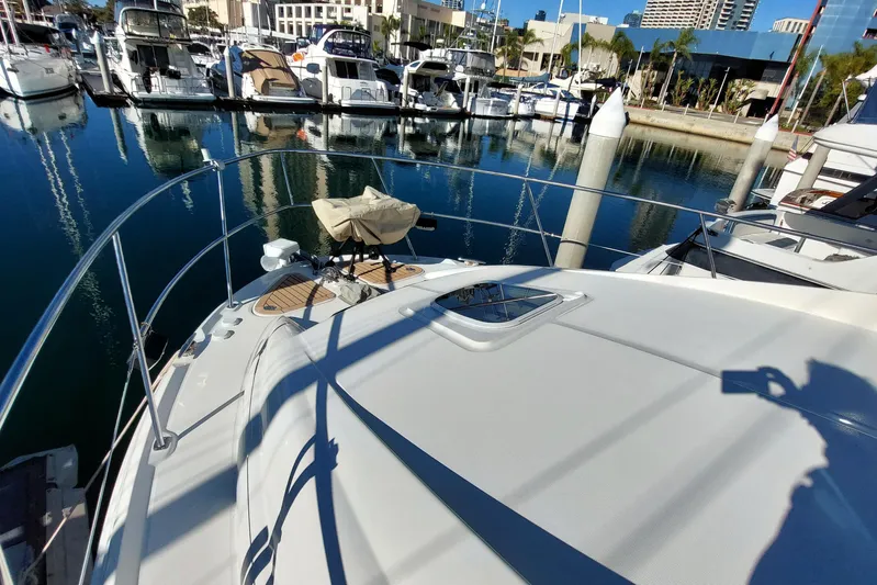 Pan-a-sea-ahh Yacht Photos Pics 2004 Sea Ray 390 Motor Yacht docked in a marina, surrounded by other boats.