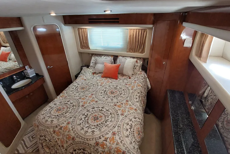 Pan-a-sea-ahh Yacht Photos Pics Luxurious 2004 Sea Ray 390 Motor Yacht bedroom with elegant bedding and wood finishes.
