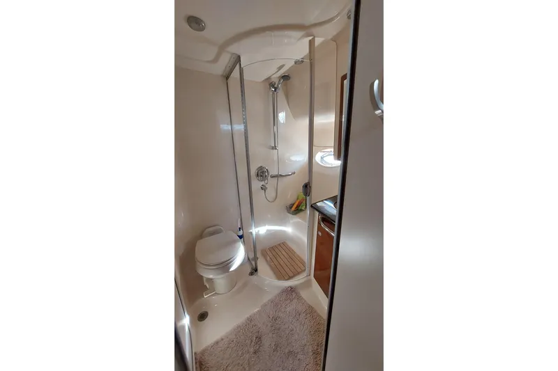 Pan-a-sea-ahh Yacht Photos Pics Bathroom interior of 2004 Sea Ray 390 Motor Yacht with shower and toilet.