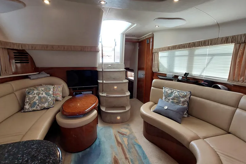 Pan-a-sea-ahh Yacht Photos Pics Luxurious interior of 2004 Sea Ray 390 Motor Yacht with plush seating and elegant decor.