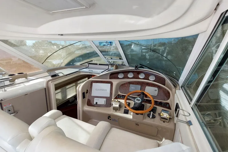Pan-a-sea-ahh Yacht Photos Pics 2004 Sea Ray 390 Motor Yacht helm with Garmin navigation and luxurious interior.