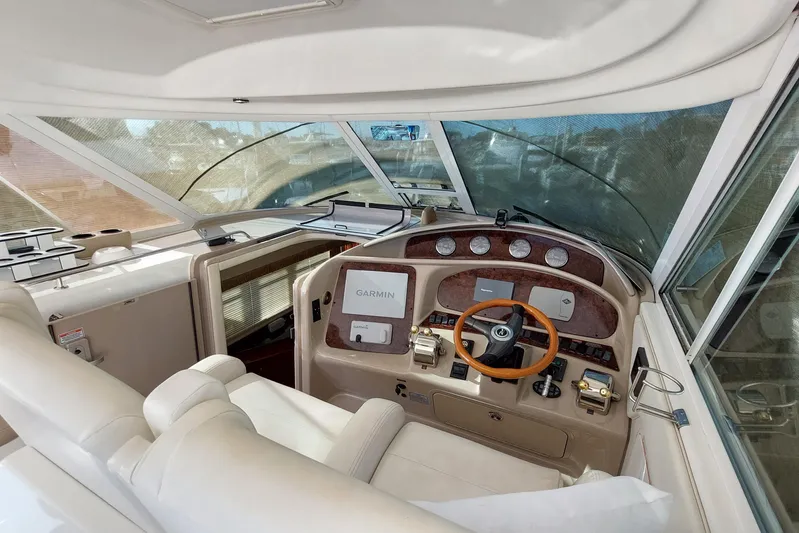 Pan-a-sea-ahh Yacht Photos Pics 2004 Sea Ray 390 Motor Yacht helm with Garmin navigation, luxurious interior, and panoramic windows.