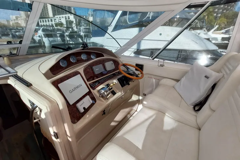 Pan-a-sea-ahh Yacht Photos Pics 2004 Sea Ray 390 Motor Yacht helm with Garmin navigation, luxurious seating, and modern controls.