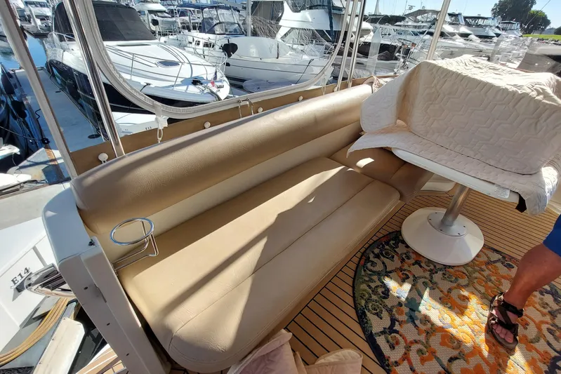 Pan-a-sea-ahh Yacht Photos Pics 2004 Sea Ray 390 Motor Yacht interior with beige seating and marina view.