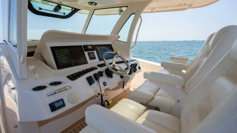 Carpe Diem Yacht Photos Pics 2019 Grady-White 376 Canyon helm with luxurious seating and advanced navigation controls.