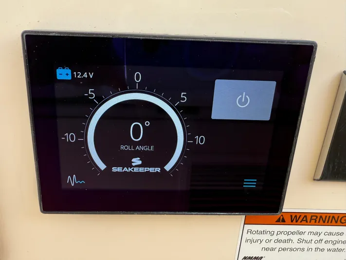 335-514 Brokerage Ron Yacht Photos Pics Seakeeper control panel on 2023 Grady-White Freedom 335, displaying roll angle and battery voltage.