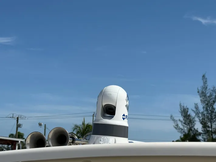 335-514 Brokerage Ron Yacht Photos Pics 2023 Grady-White Freedom 335 boat with radar equipment against a clear blue sky.