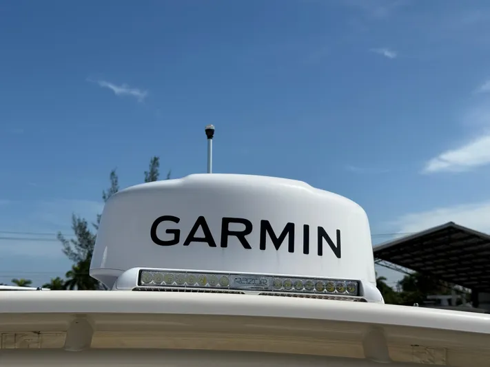 335-514 Brokerage Ron Yacht Photos Pics Garmin radar on 2023 Grady-White Freedom 335 boat under clear blue sky.