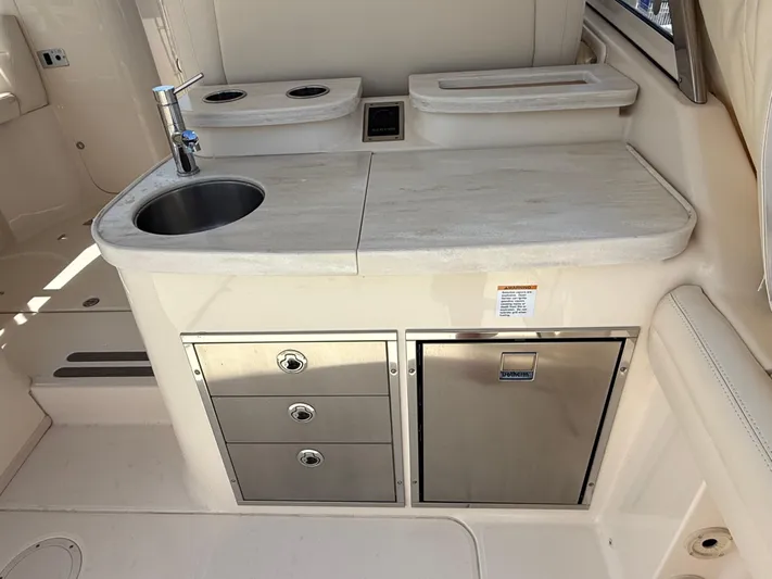 335-514 Brokerage Ron Yacht Photos Pics 2023 Grady-White Freedom 335 boat interior with sink, storage drawers, and countertop.