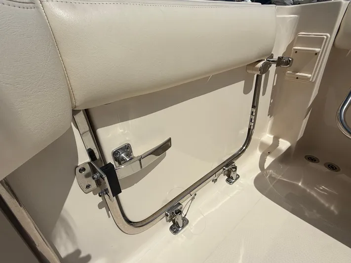 335-514 Brokerage Ron Yacht Photos Pics 2023 Grady-White Freedom 335 boat interior, featuring a sleek, cream-colored seating area.