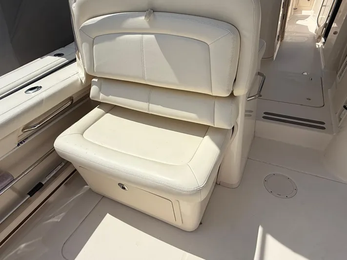 335-514 Brokerage Ron Yacht Photos Pics 2023 Grady-White Freedom 335 boat interior with cream leather seating.
