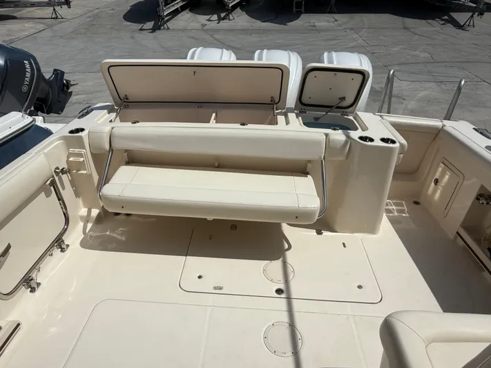 335-514 Brokerage Ron Yacht Photos Pics 2023 Grady-White Freedom 335 boat interior with seating and storage compartments.