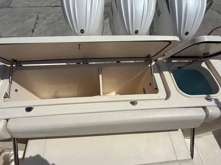 335-514 Brokerage Ron Yacht Photos Pics Open storage compartments on a 2023 Grady-White Freedom 335 boat, showcasing spacious design.