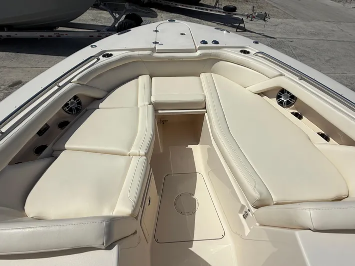 335-514 Brokerage Ron Yacht Photos Pics 2023 Grady-White Freedom 335 boat interior with cushioned seating and speakers.
