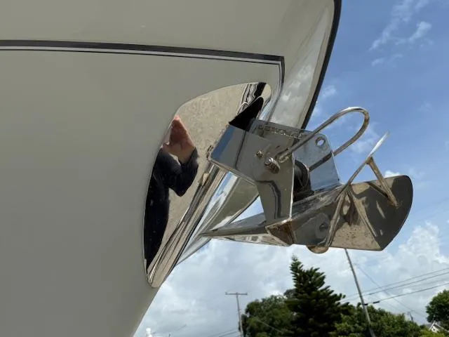 335-514 Brokerage Ron Yacht Photos Pics 2023 Grady-White Freedom 335 boat anchor detail against blue sky.