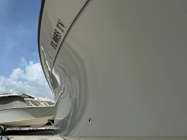 335-514 Brokerage Ron Yacht Photos Pics 2023 Grady-White Freedom 335 boat hull with clear sky background.