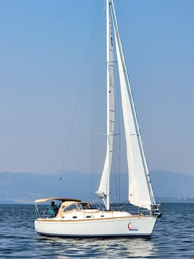 Celebration Yacht Photos Pics Sailboat Tartan 3400, 2007 model, cruising on calm waters under clear skies.