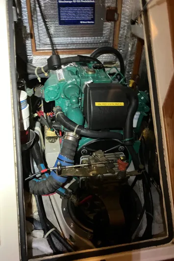 Celebration Yacht Photos Pics Engine compartment of a 2007 Tartan 3400 sailboat, featuring a well-maintained marine engine.