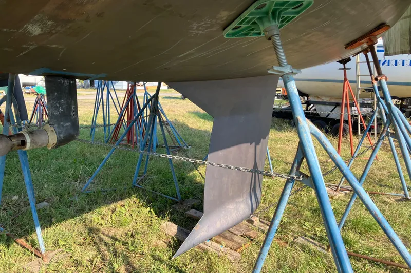 Celebration Yacht Photos Pics Underneath view of a 2007 Tartan 3400 sailboat keel on stands.