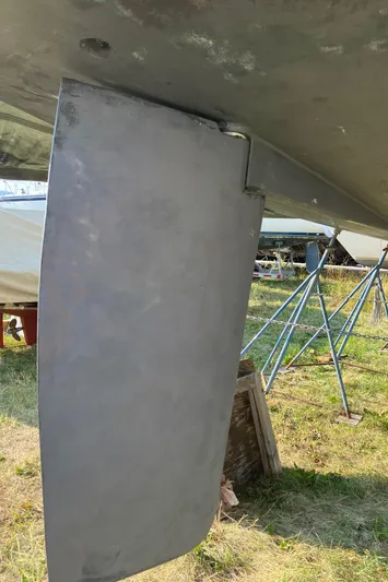 Celebration Yacht Photos Pics Rudder of 2007 Tartan 3400 sailboat on dry dock, with support stands visible.