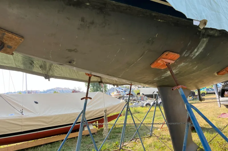 Celebration Yacht Photos Pics 2007 Tartan 3400 sailboat hull on stands, outdoor storage setting.