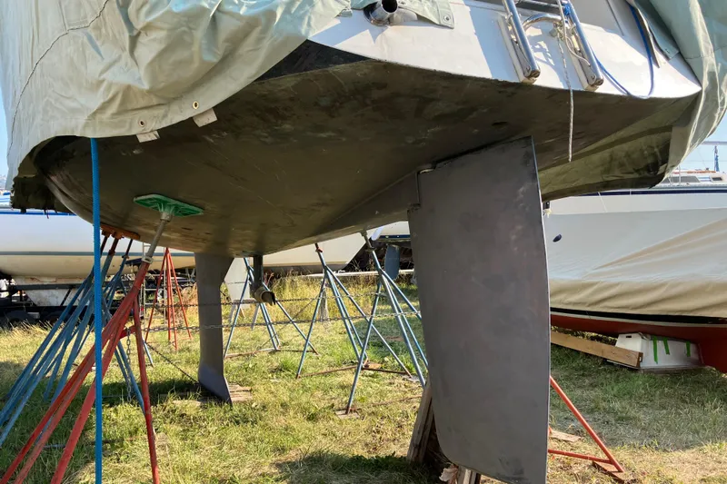 Celebration Yacht Photos Pics Tartan 3400 sailboat from 2007 on stands, under maintenance, with visible keel and rudder.