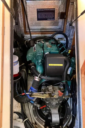 Celebration Yacht Photos Pics Engine compartment of a 2007 Tartan 3400 sailboat, featuring a well-maintained marine engine.